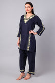 Woman wearing a navy blue traditional Cotton Summer Cord set with Aari embroidery-Left