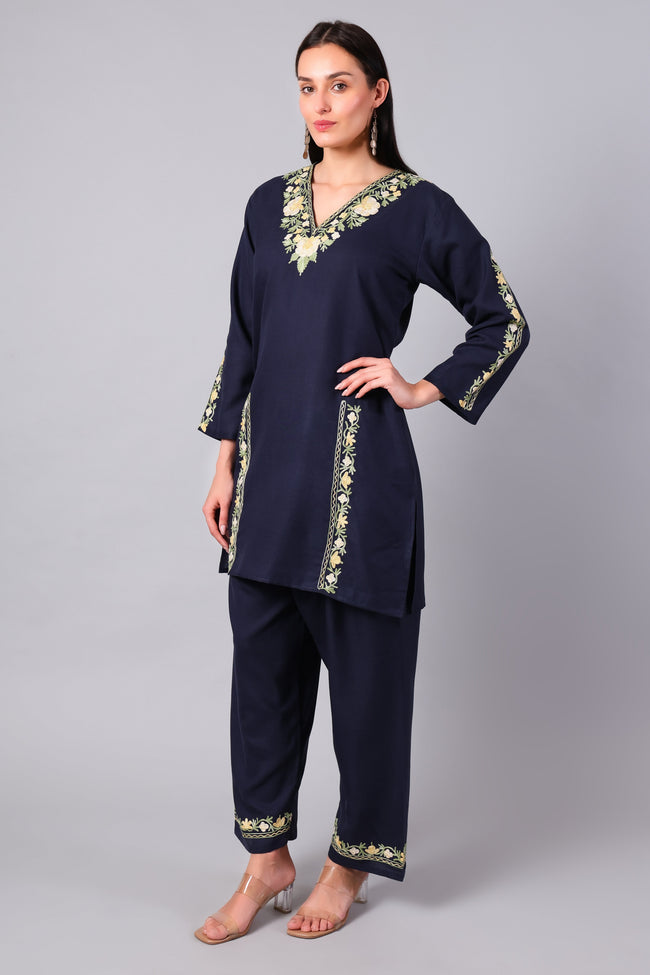 Woman wearing a navy blue traditional Cotton Summer Cord set with Aari embroidery-Left