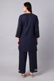 Woman wearing a navy blue traditional Cotton Summer Cord set with Aari embroidery- back