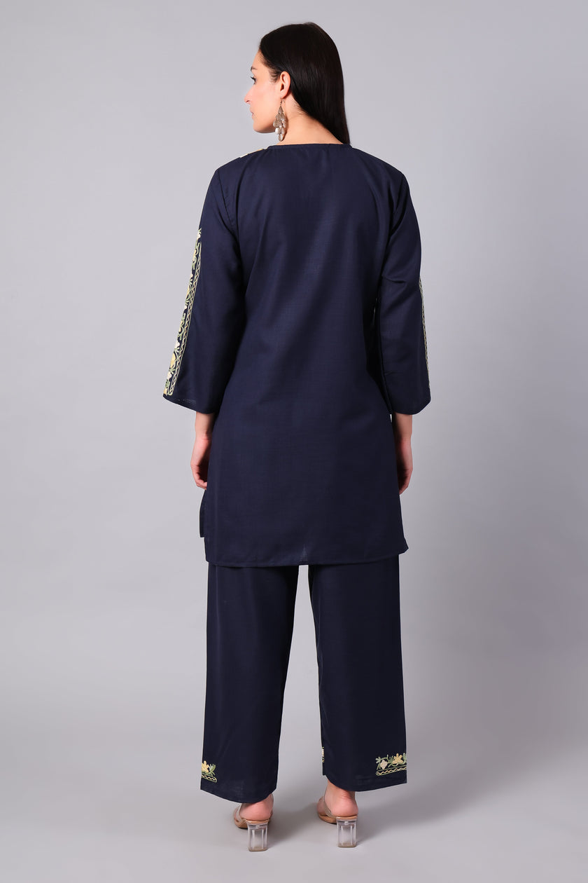 Woman wearing a navy blue traditional Cotton Summer Cord set with Aari embroidery- back
