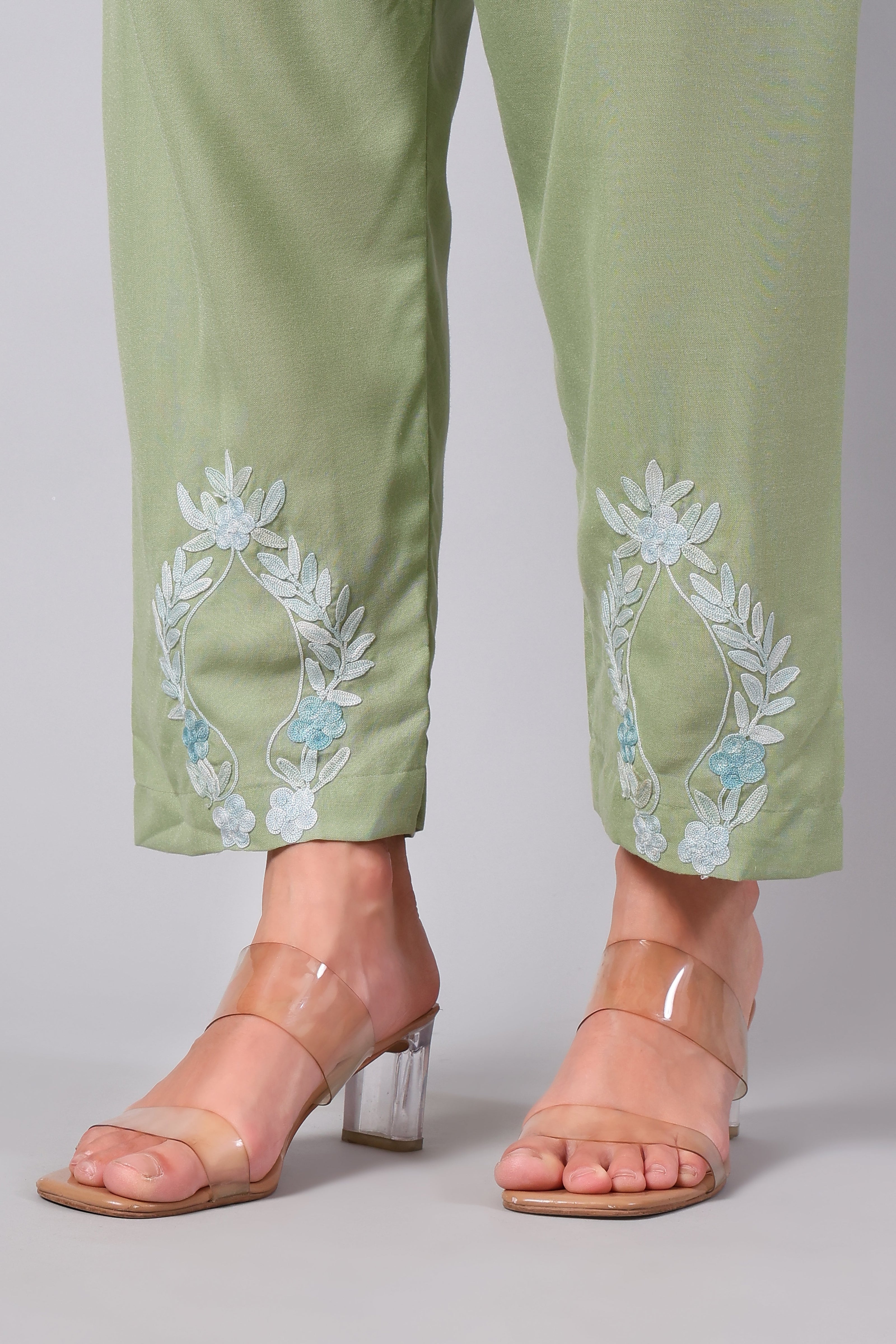 Detailed view of powder blue Aari embroidery on sage green co-ord set pants