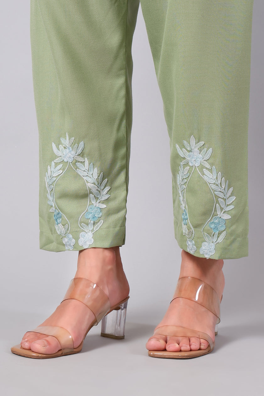 Detailed view of powder blue Aari embroidery on sage green co-ord set pants
