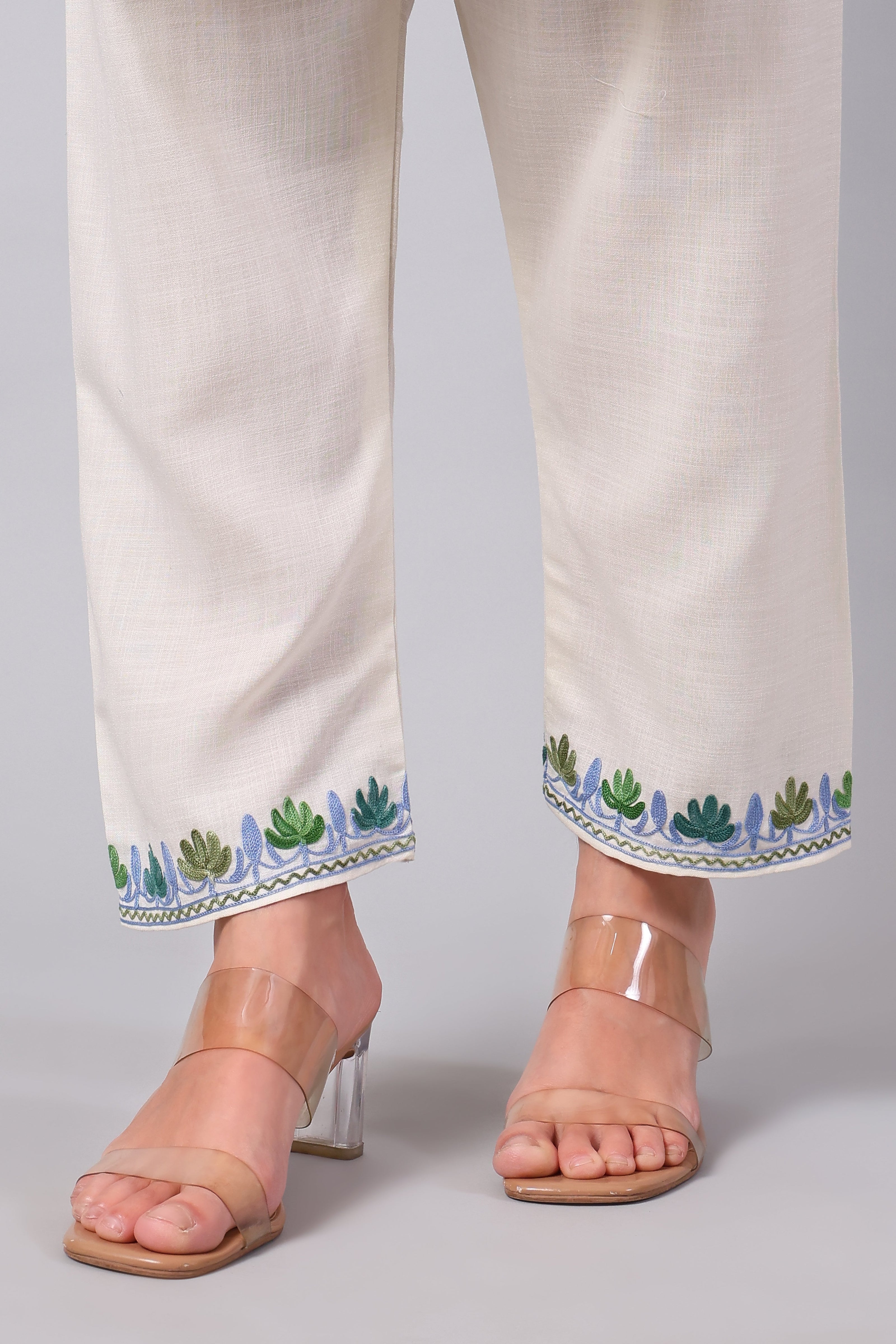 Detailed view of Aari embroidery on ivory co-ord set pants hemline
