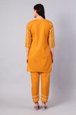 Back view of sunlit amber Kashmiri Aari co-ord set for women