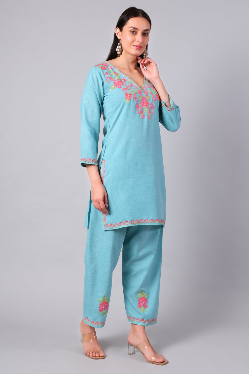 Front view of aqua blue Kashmiri Aari co-ord set with coral pink embroidery for women