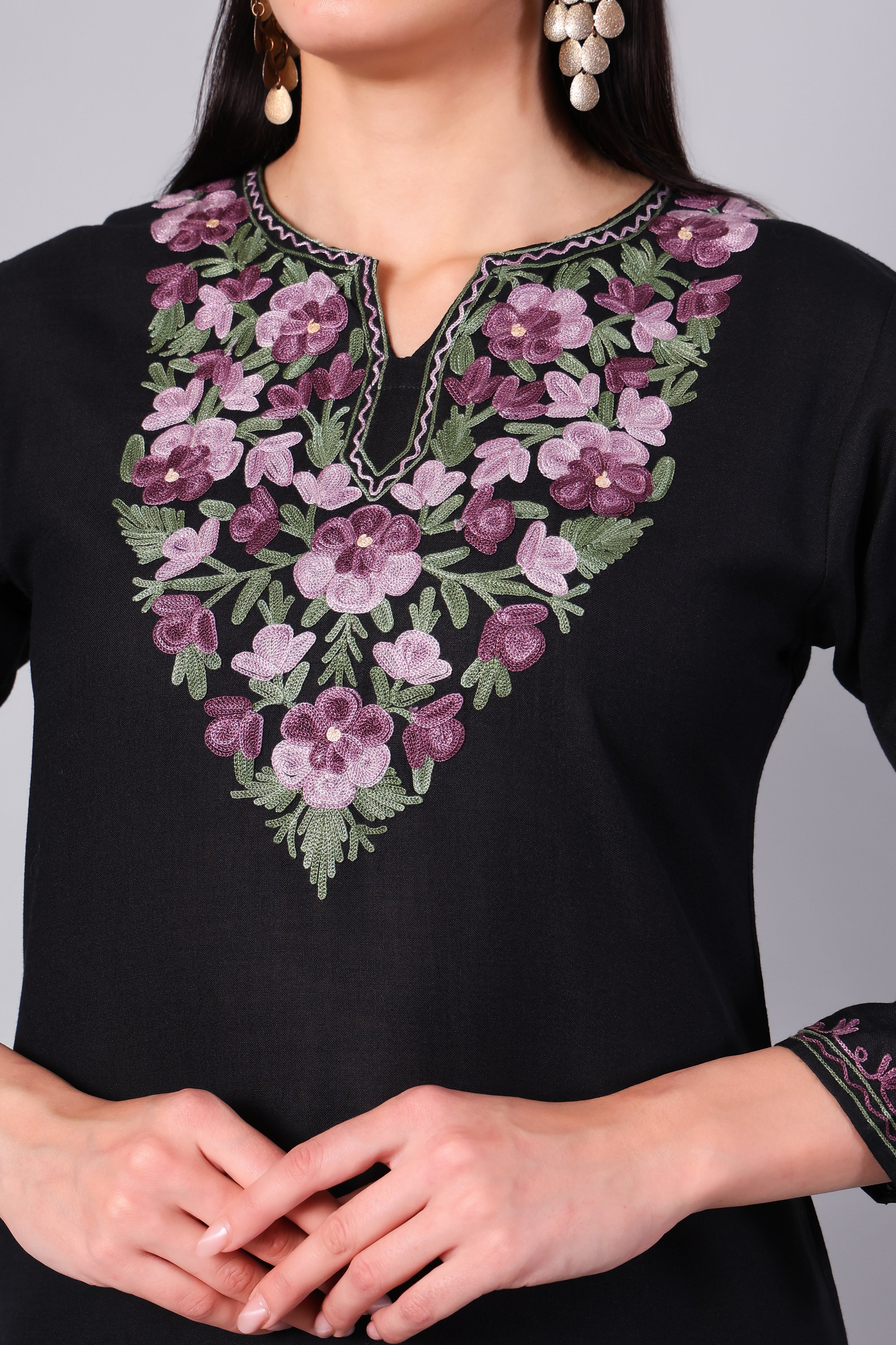 Close-up of dusty pink Kashmiri Aari embroidery on black co-ord set neckline