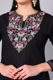 Close-up of dusty pink Kashmiri Aari embroidery on black co-ord set neckline