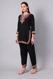 Full outfit of black co-ord set with detailed hemline and pant embroidery