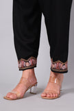 Close-up of Aari embroidery on pant hem of black co-ord set
