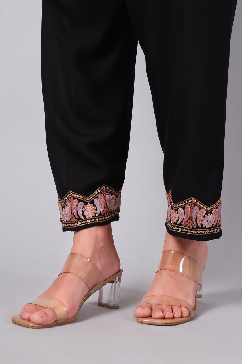 Close-up of Aari embroidery on pant hem of black co-ord set