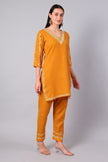 Side view of amber co-ord set with straight-cut tunic and side slits