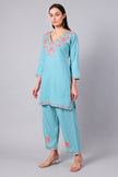 Side view of aqua blue co-ord set with straight-cut tunic and side slits