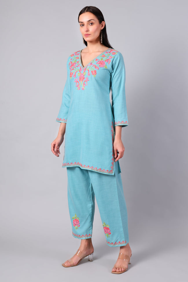 Side view of aqua blue co-ord set with straight-cut tunic and side slits