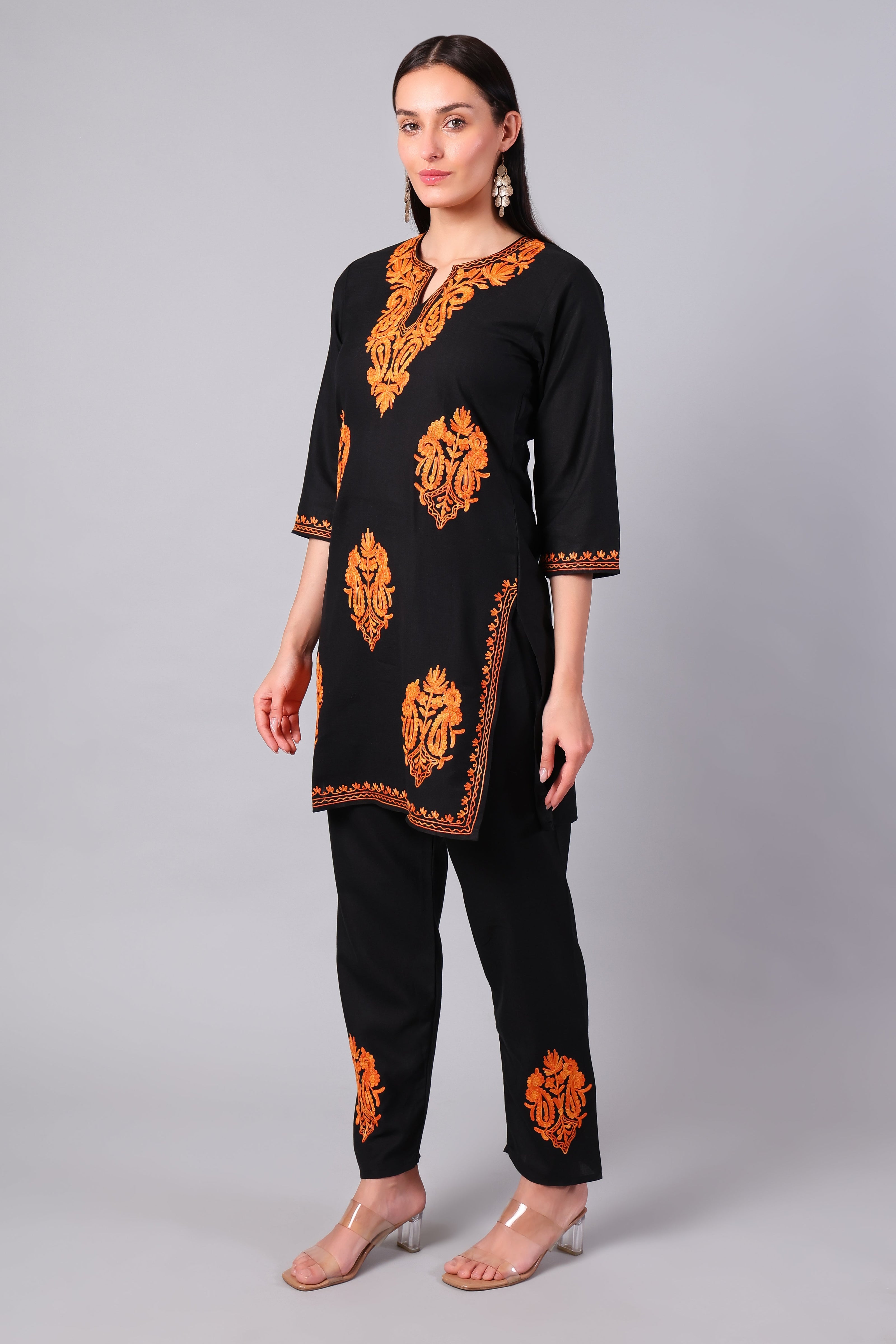 Side view of black co-ord set with straight-cut tunic and side slits