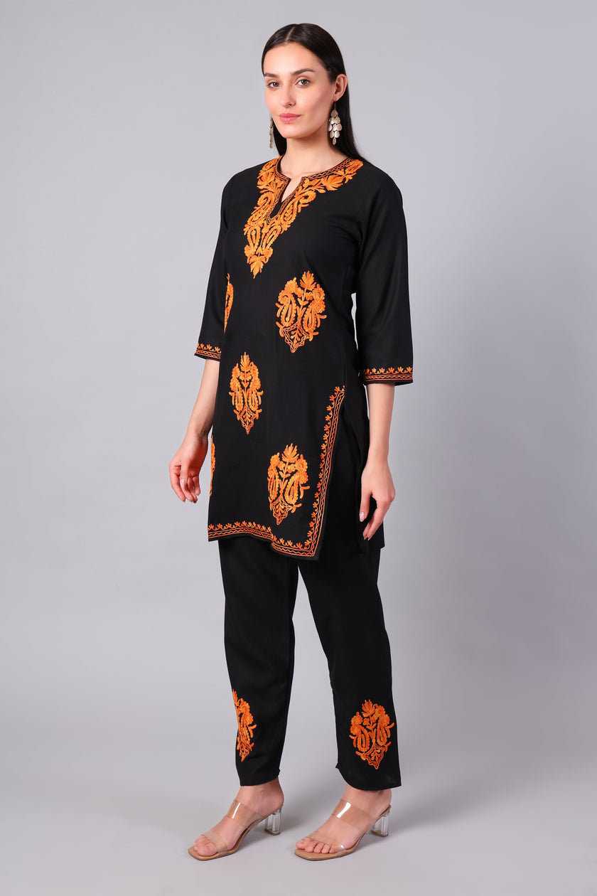 Side view of black co-ord set with straight-cut tunic and side slits