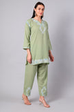 Side view of sage green co-ord set with straight-cut tunic and side slits