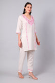 Side view of white co-ord set with straight-cut tunic and side slits