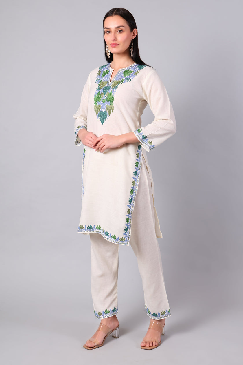Right Side view of ivory Kashmiri co-ord set with straight-cut tunic and side slits