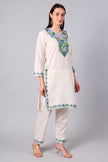 Side view of ivory Kashmiri co-ord set with straight-cut tunic and side slits