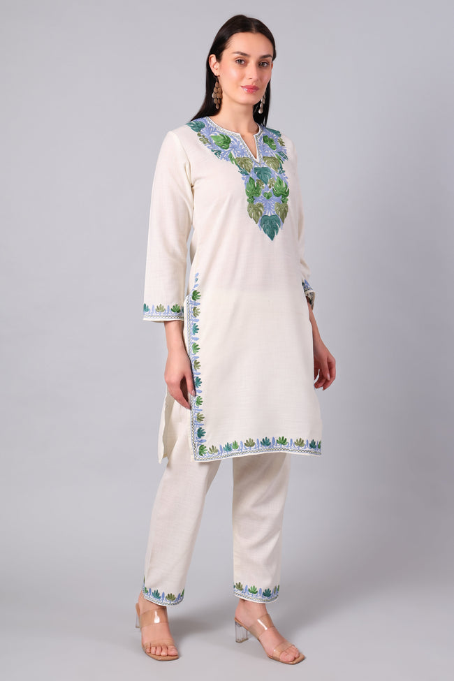 Side view of ivory Kashmiri co-ord set with straight-cut tunic and side slits