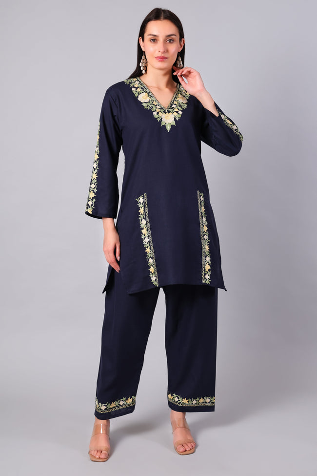 Woman wearing a navy blue traditional Cotton Summer Cord set with Aari embroidery