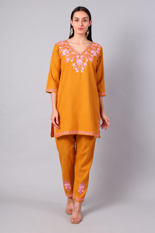 Front view of saffron Kashmiri Aari co-ord set with blush pink embroidery for women