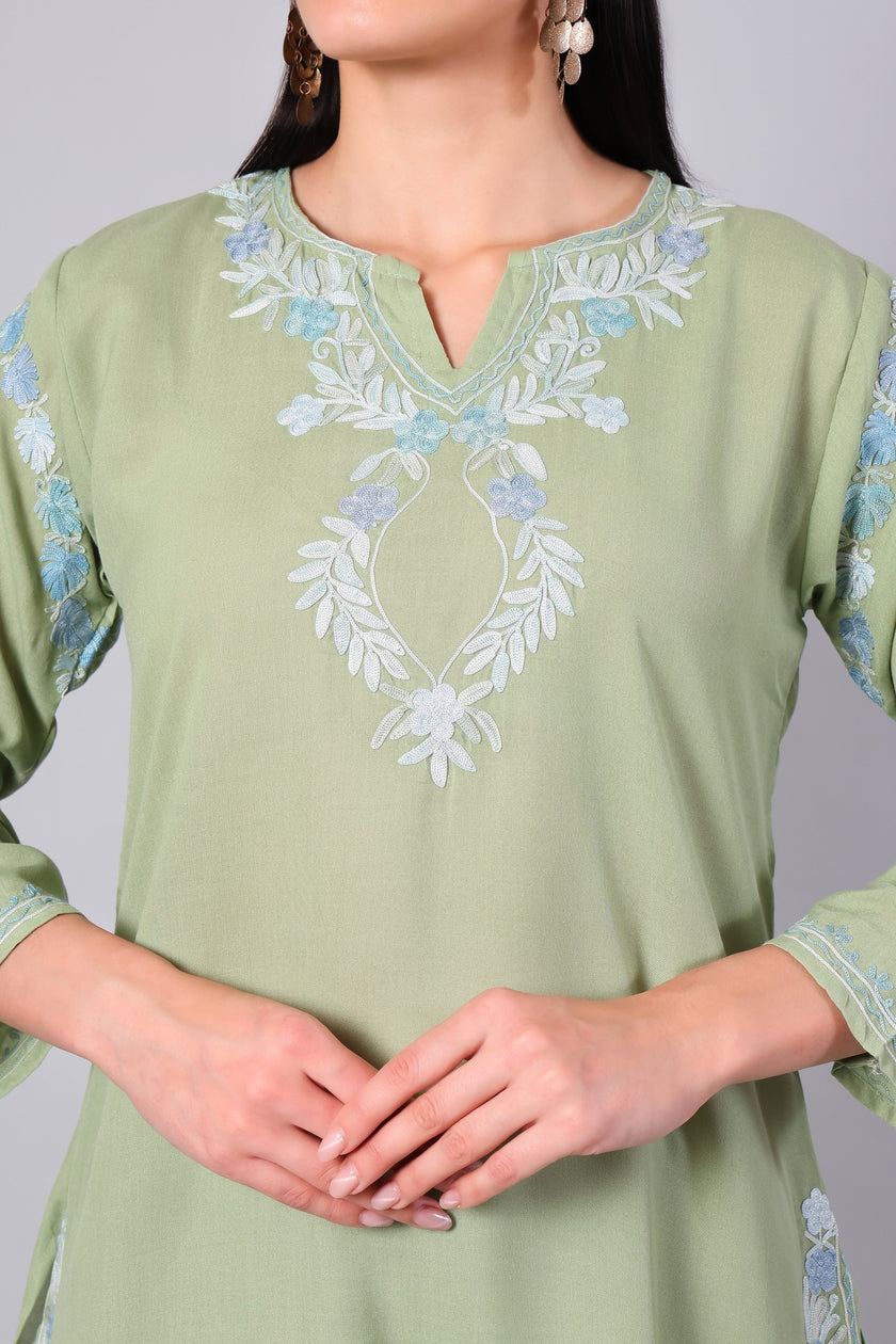Close-up of powder blue Kashmiri Aari embroidery on sage green co-ord set neckline