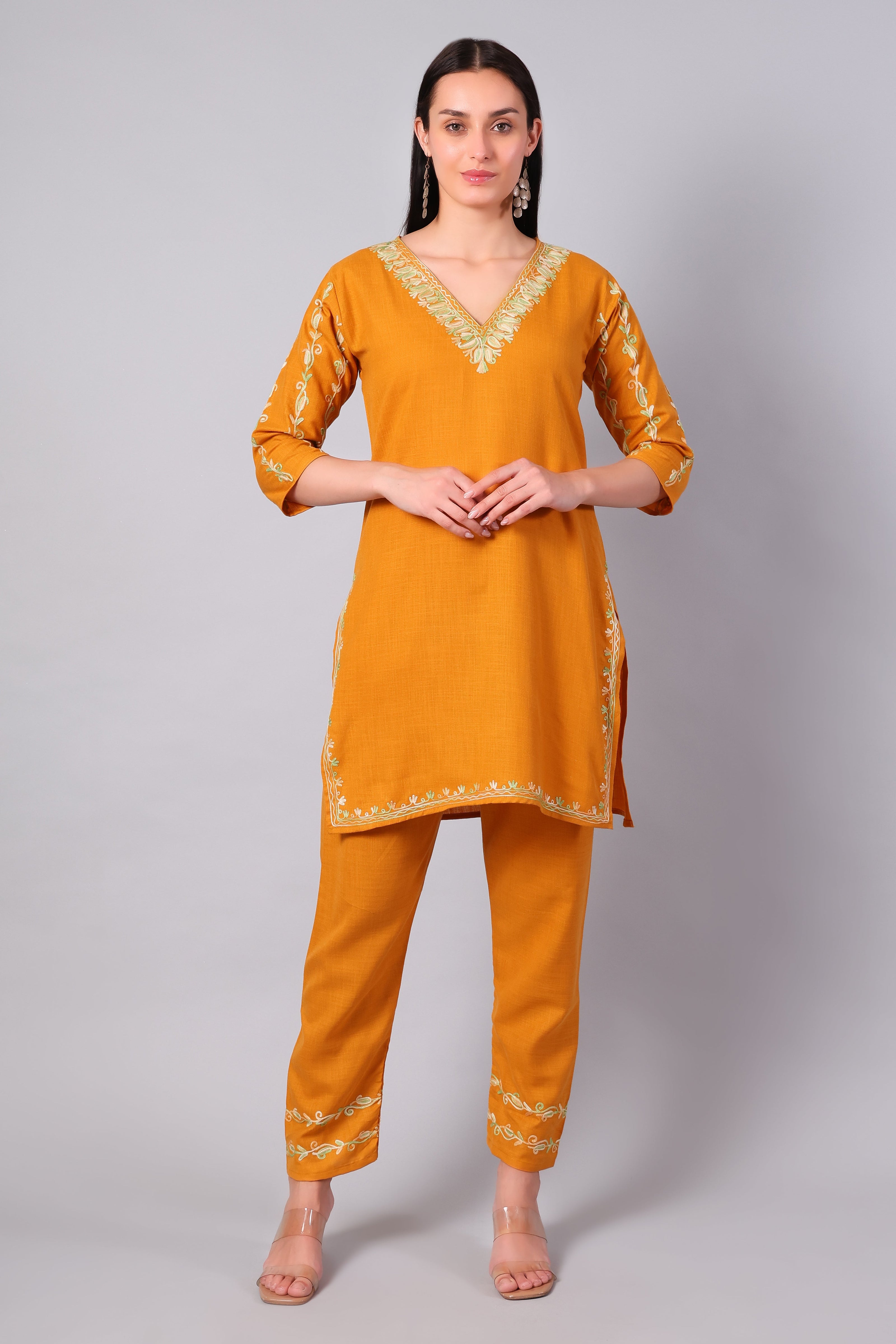 Front view of sunlit amber Kashmiri Aari co-ord set with green embroidery for women