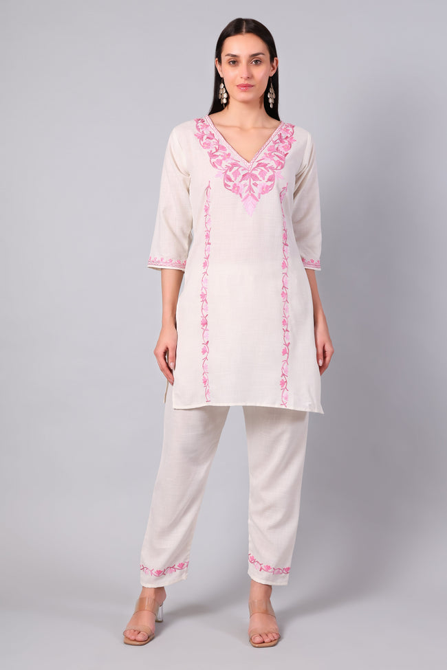 Front view of white Kashmiri Aari co-ord set with pink embroidery for women