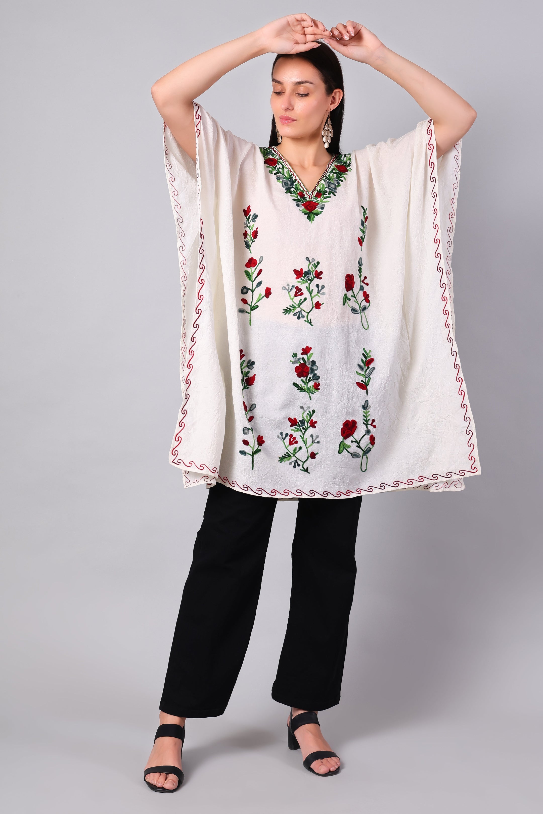 Novbahar white Kashmiri kaftan — front angle with red and green embroidery detail
