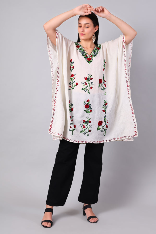 Novbahar white Kashmiri kaftan — front angle with red and green embroidery detail